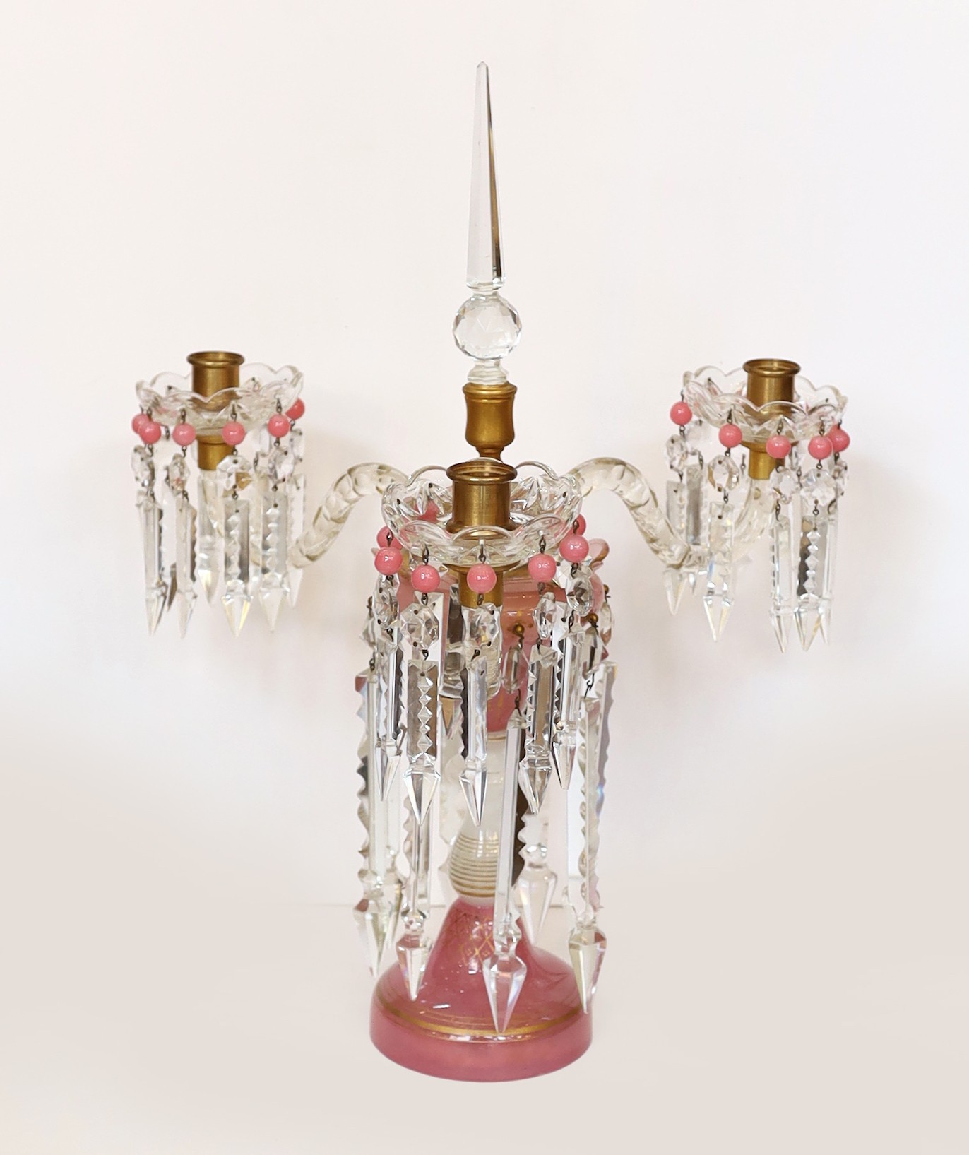 A pair of Victorian opaque pink and white glass lustre candelabra, with spear shaped finials and cut glass scrolling branches, height 52cm